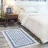Ivory and Blue Geometric Area Rug